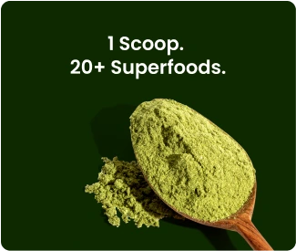 A picture of supergreens in a wooden spoon. The text overlay reads: 1 Scoop. 20+ Superfoods.